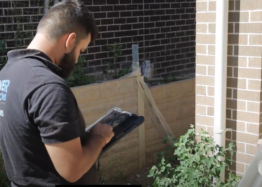 Building inspector conducting comprehensive house inspection